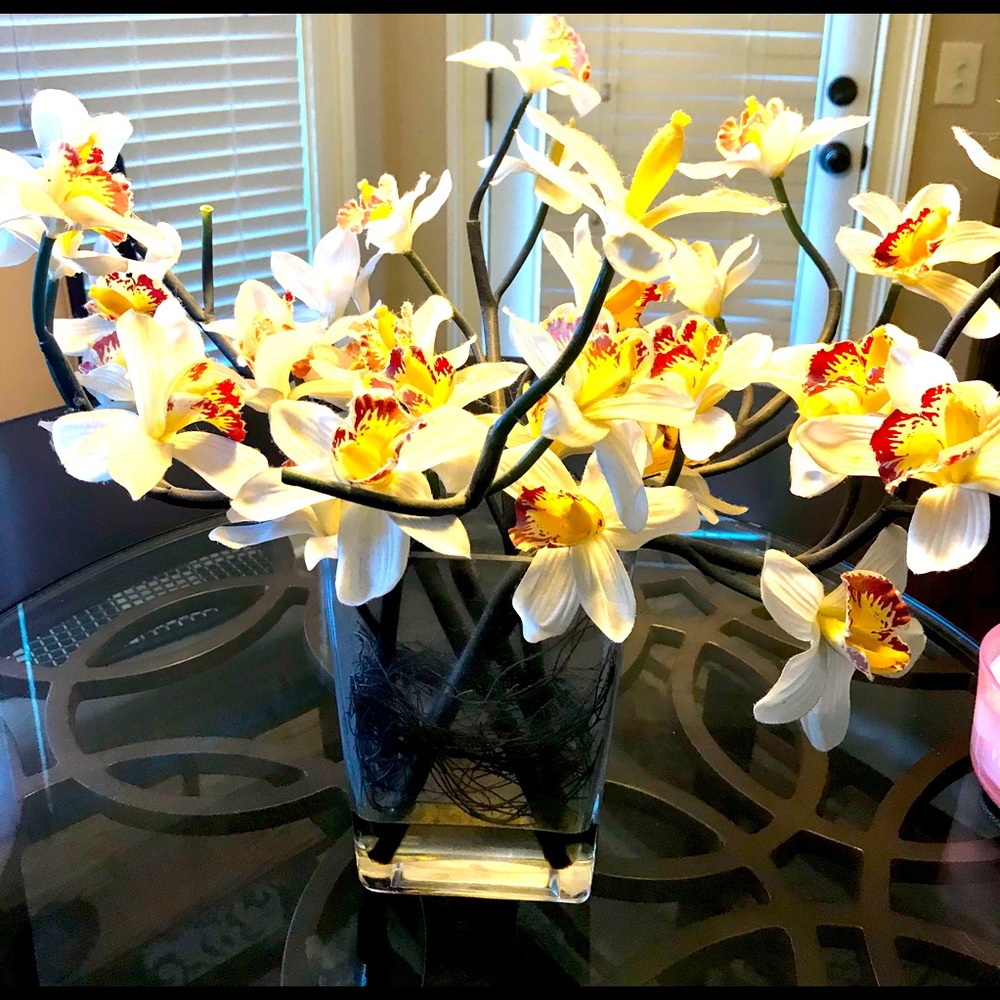Orchids in a vase flower arrangement